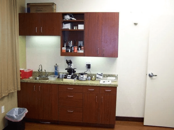 a room with a cabinet and a sink